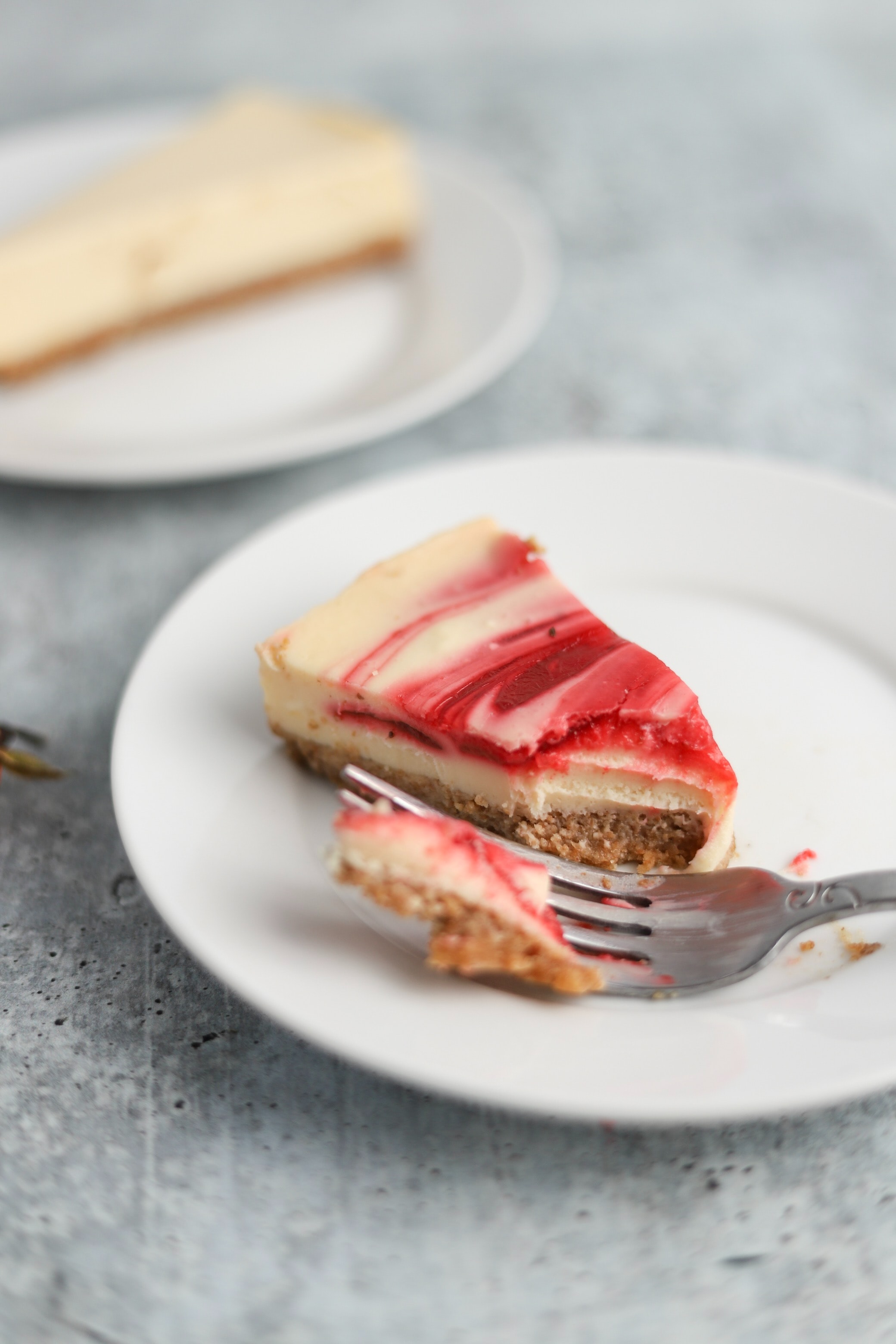 White cheesecake with red swirl 